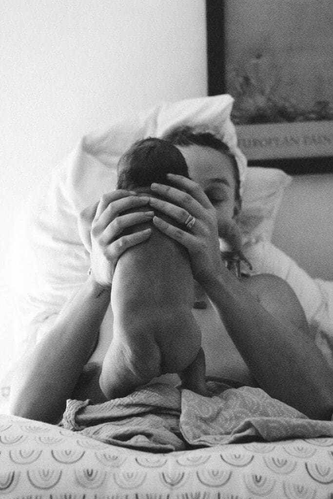 holding up baby for the first time
